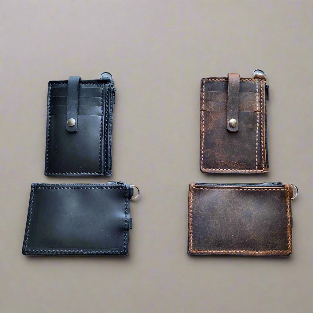 Leather keychain wallets displayed in various colors, showcasing different shades and finishes. Back of the leather keychain wallet, showing smooth, full-grain leather and minimalistic design
