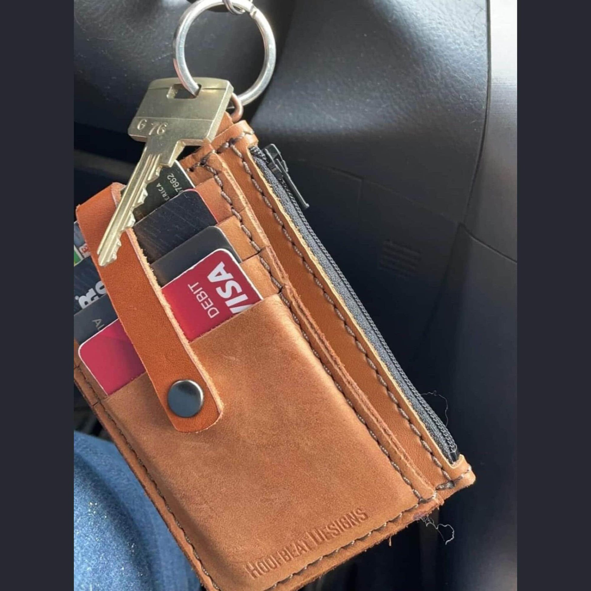 Leather keychain wallet attached to a set of keys for a convenient and stylish everyday carry option.