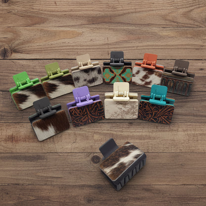 Collection of various hair clip designs on a wooden background